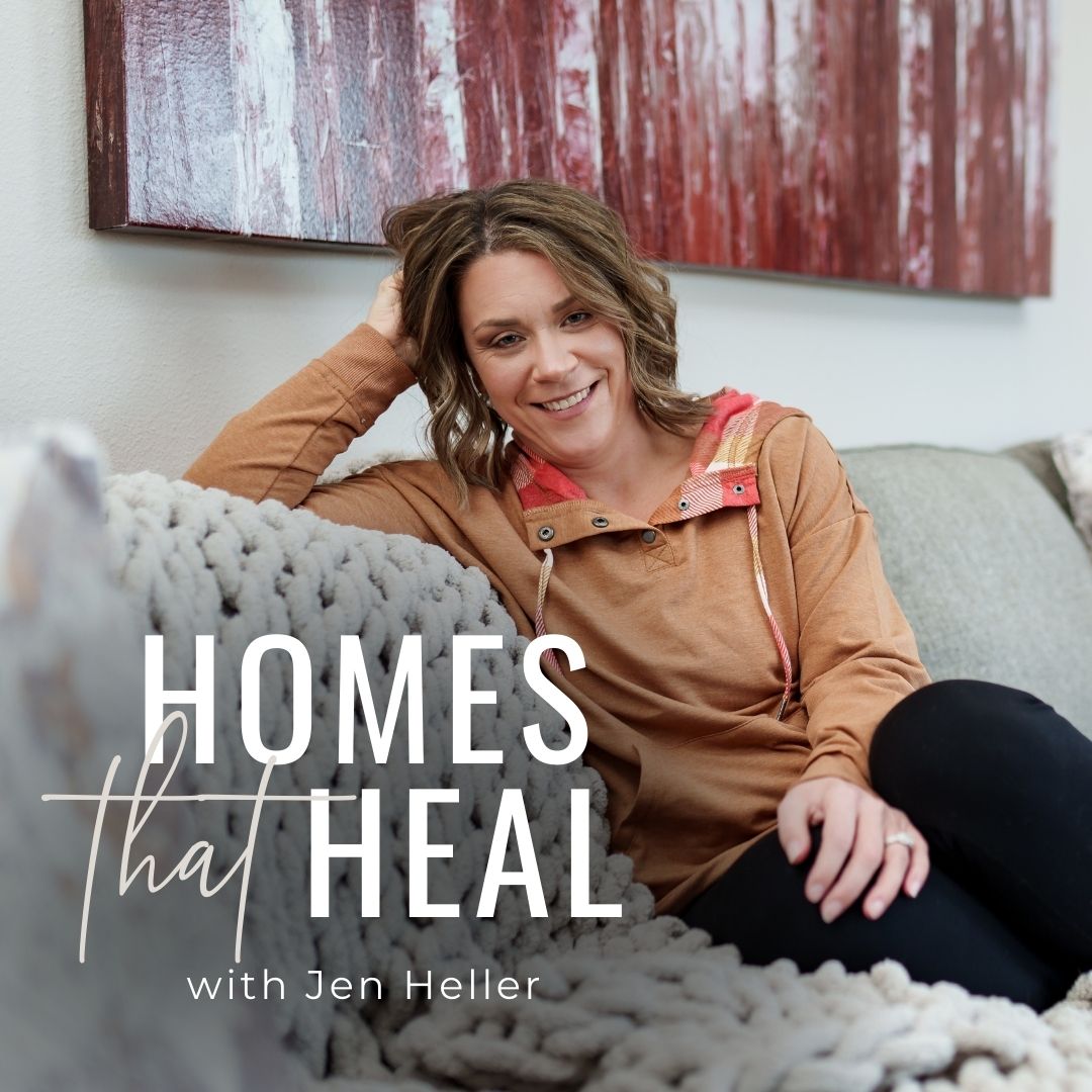 jen heller sitting on sofa smiling at camera